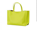 AMPERSAND AS
APOSTROPHE women's leather sideways tote bag in neon yellow $624