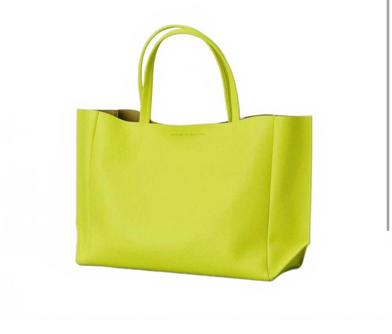 AMPERSAND AS
APOSTROPHE women's leather sideways tote bag in neon yellow $624